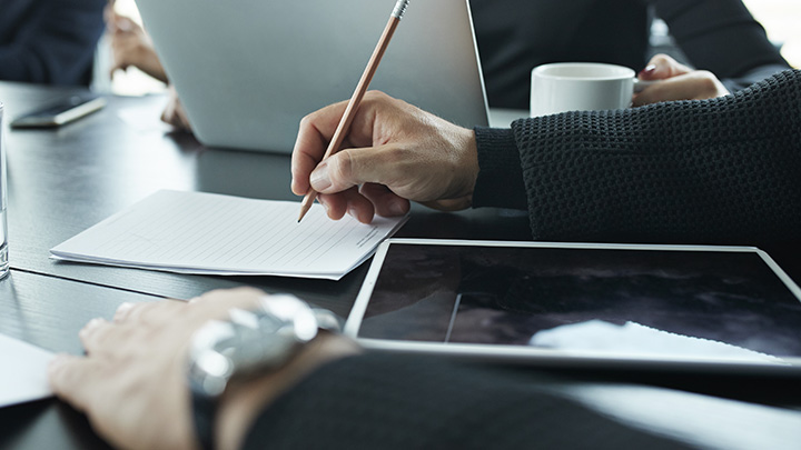 Businessman writing at a desk