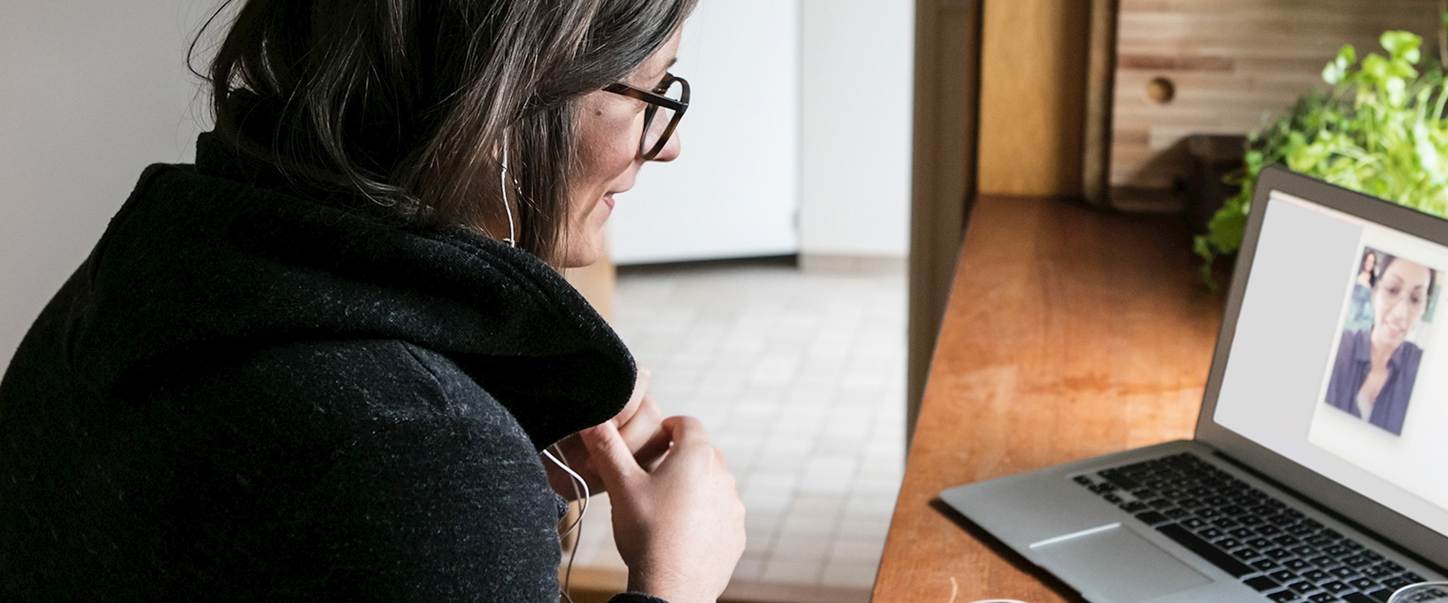 Woman video chatting on a laptop