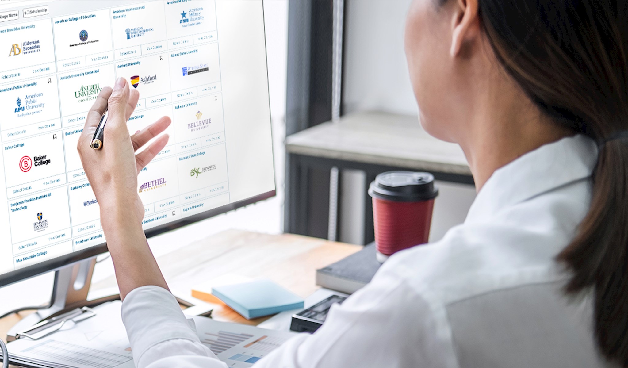 Woman working in front of a computer screen