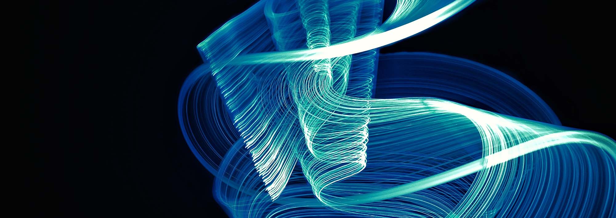 Abstract blue swirls on black background