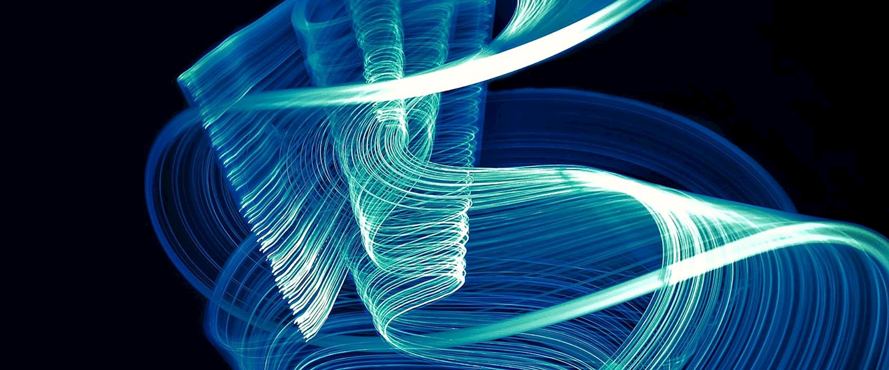 Abstract blue swirls on black background