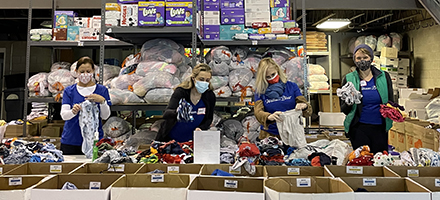 William Blair employees sorting clothes for the Community Giving Tree in Boston