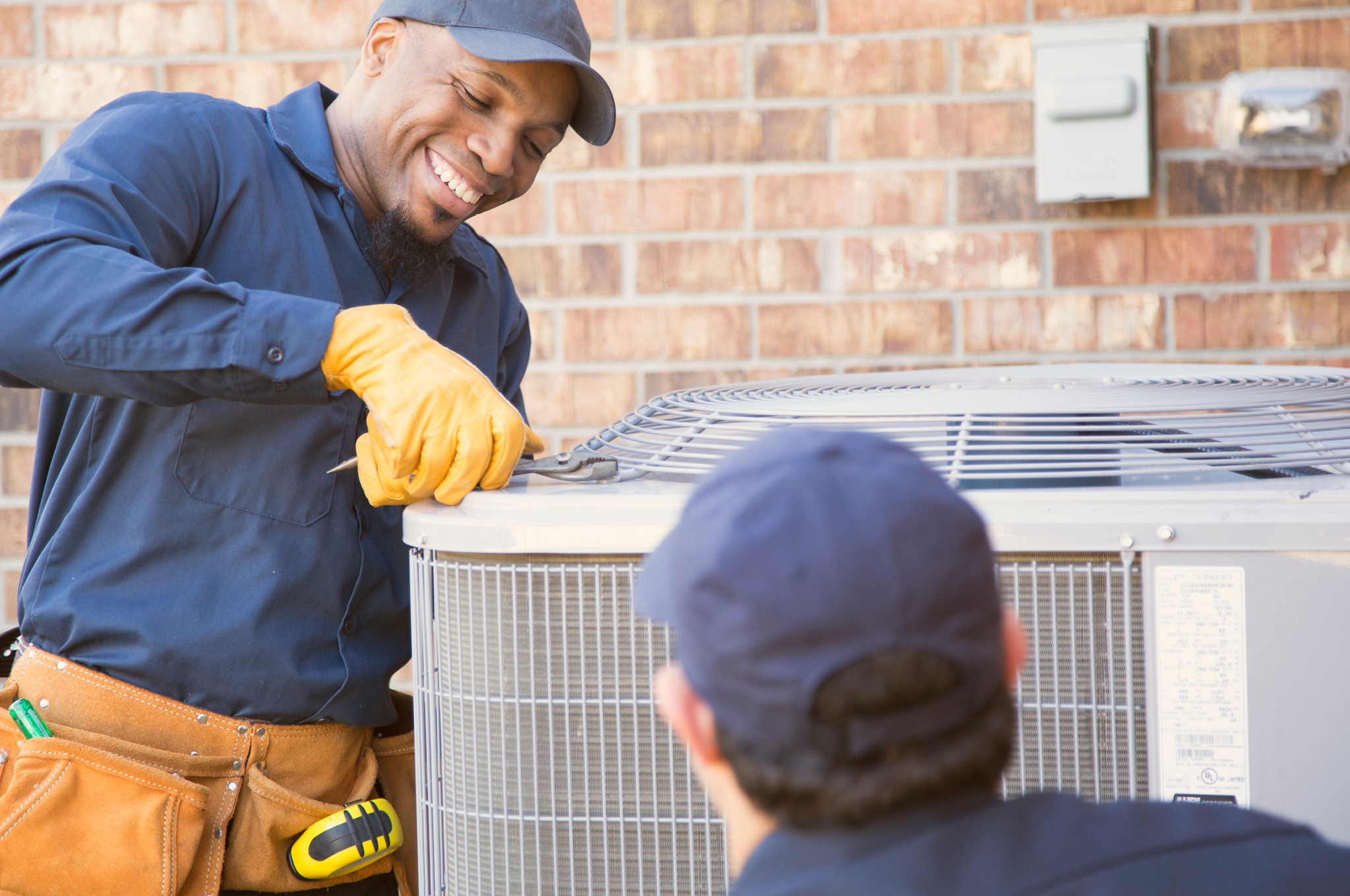 Man servicing an air conditioner