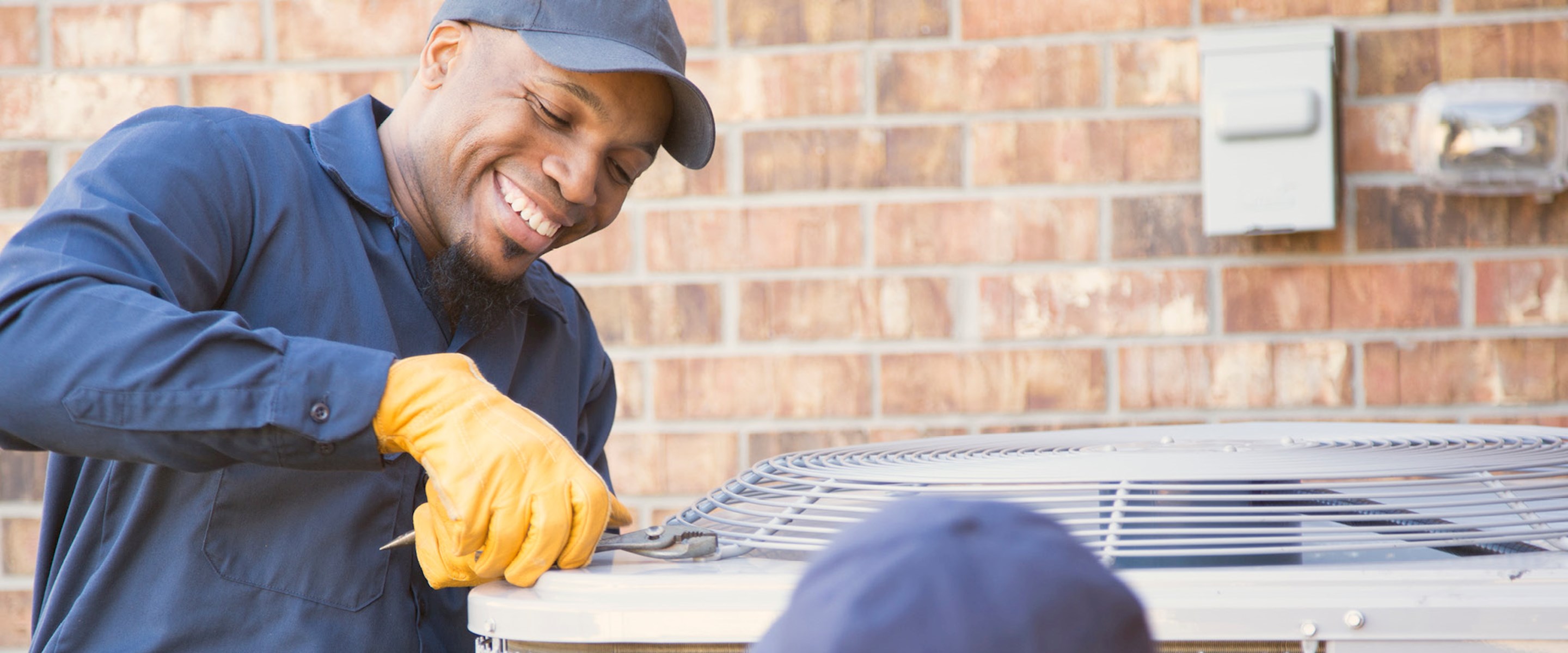 Man servicing an air conditioner