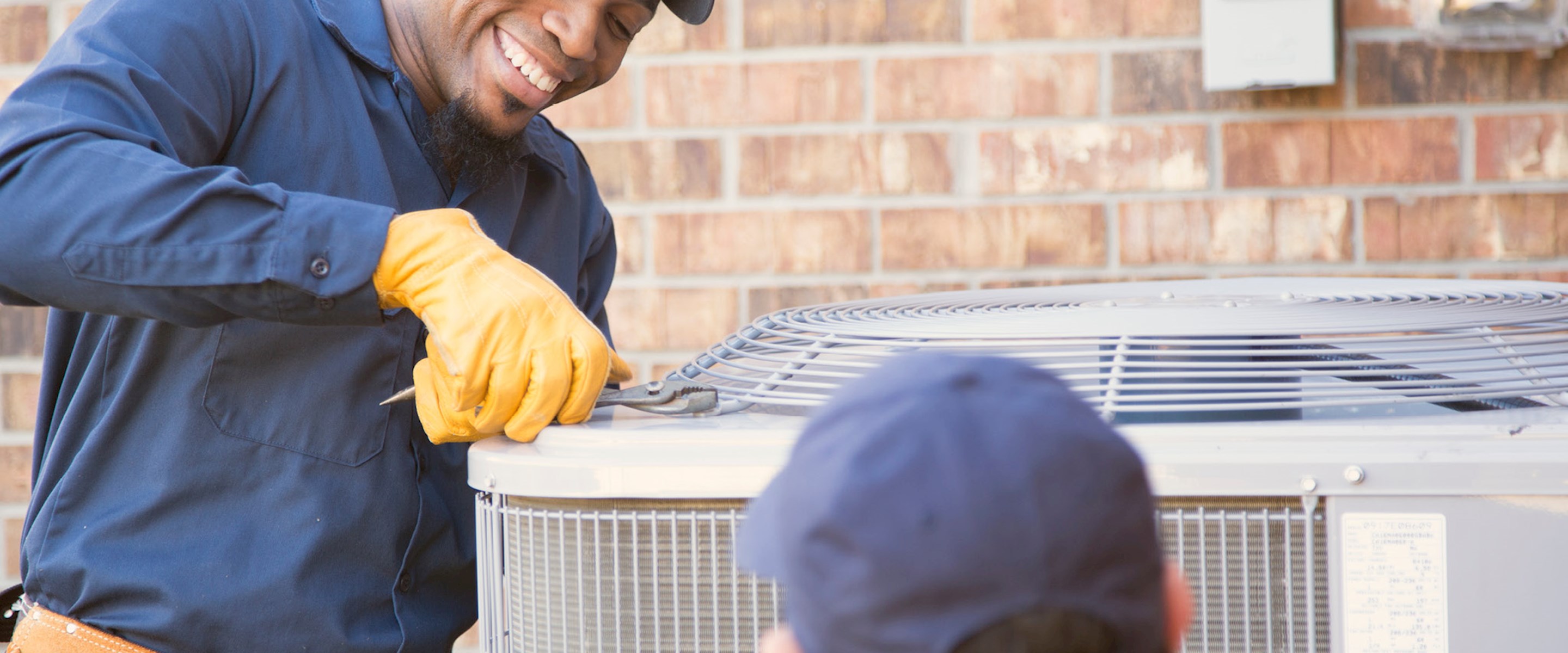 Man servicing an air conditioner