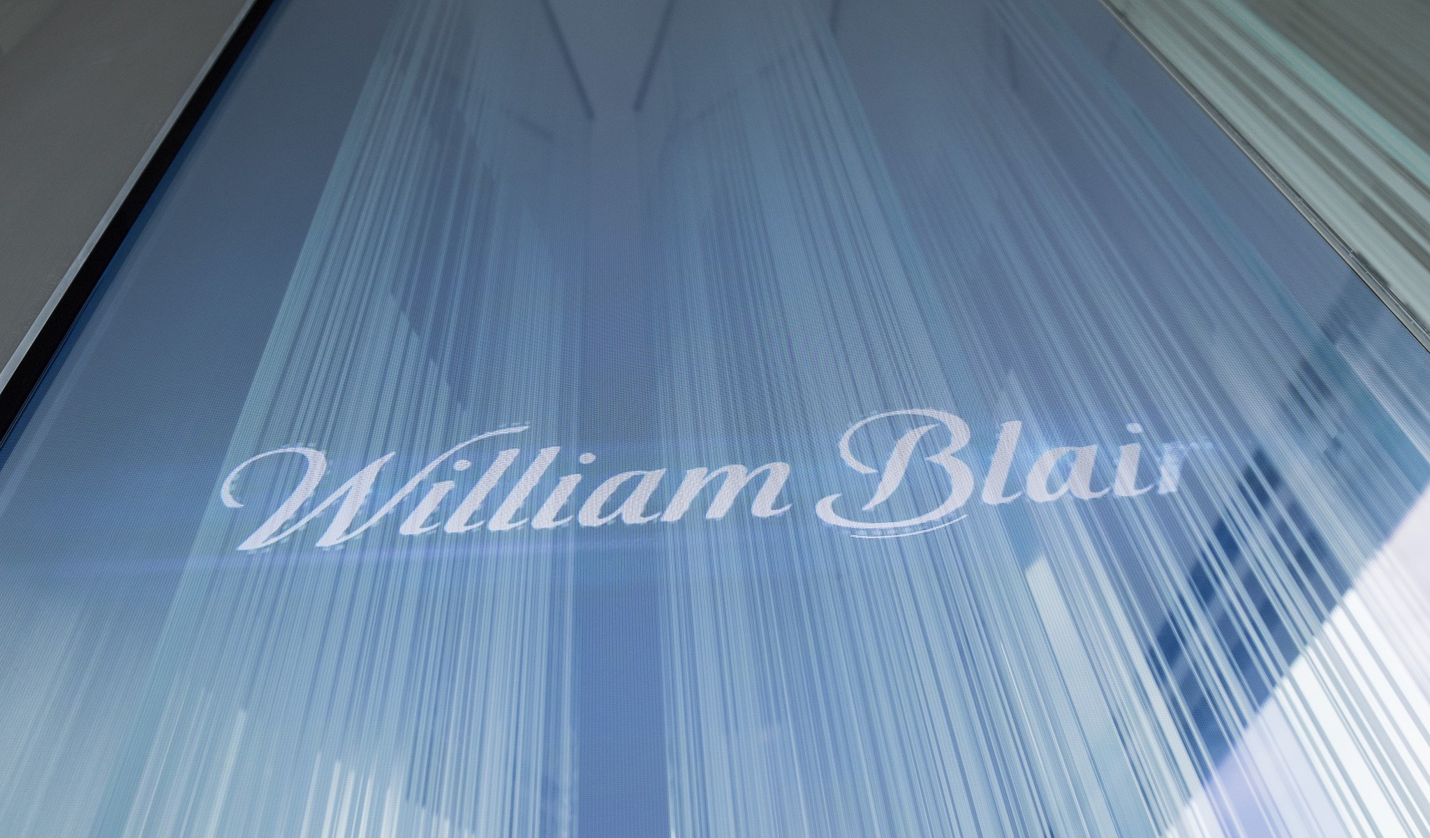William Blair logo etched on a glass wall