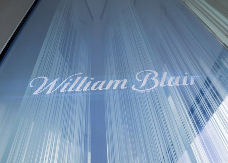 William Blair logo etched on a glass wall