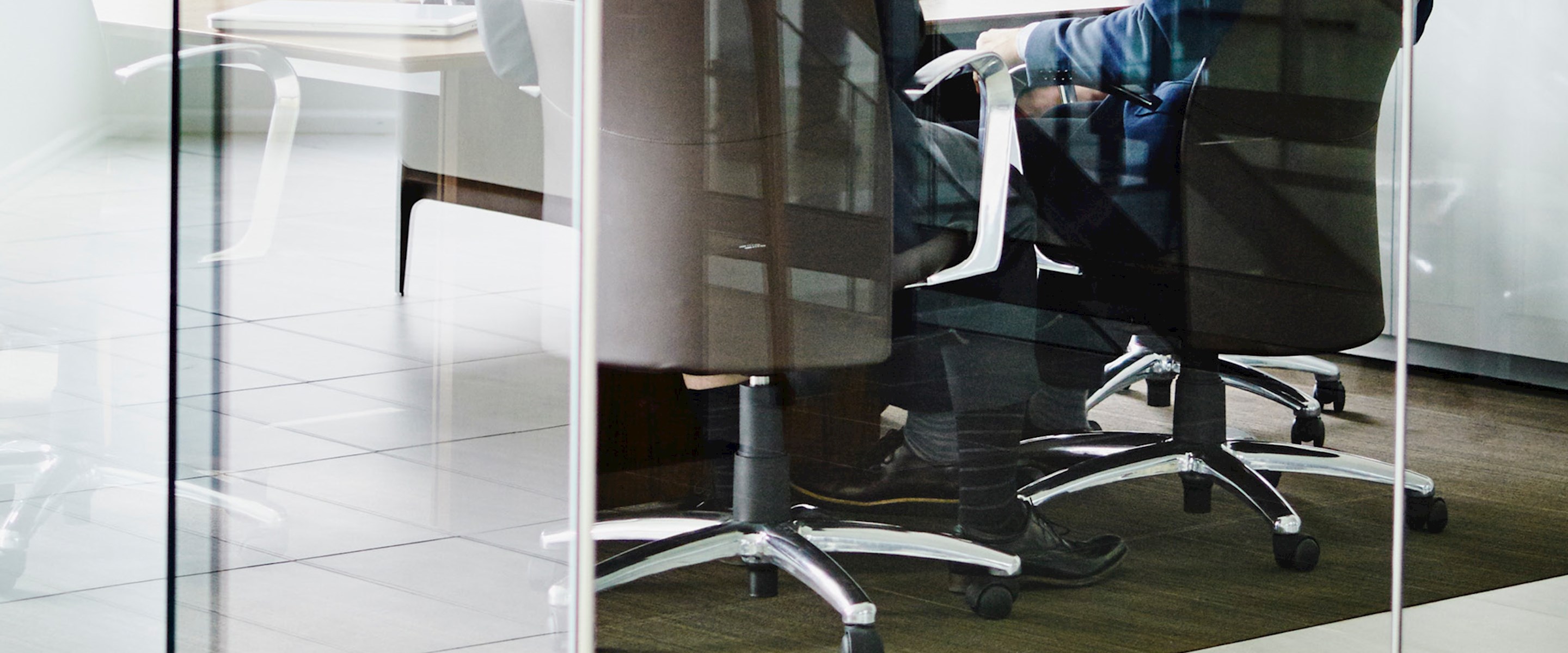 People sitting at a table in a conference room
