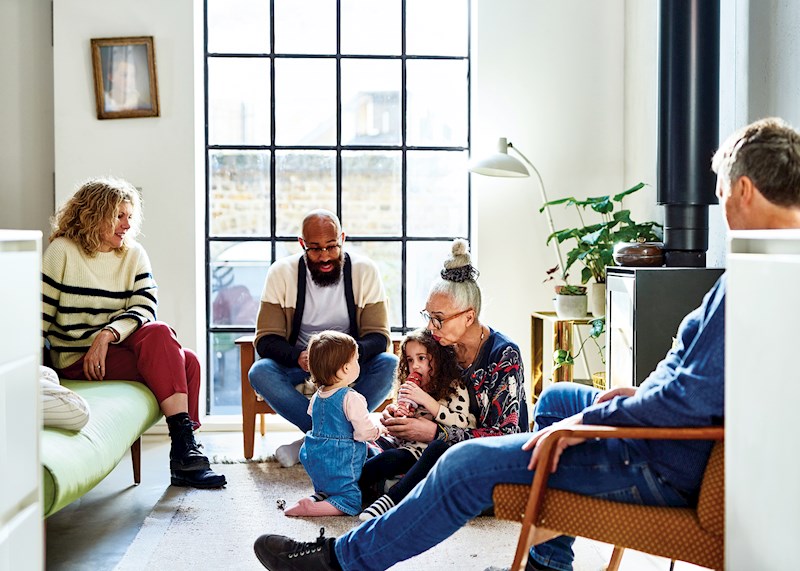 Family sitting in a family room