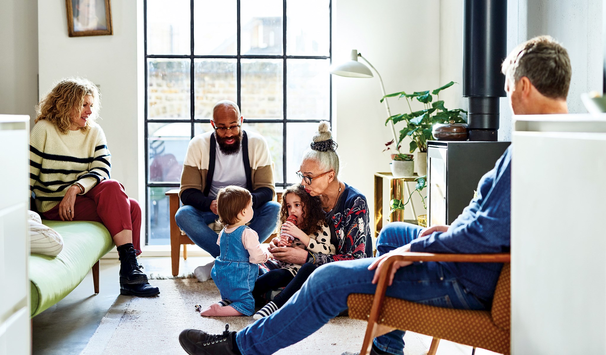 Family sitting in a family room