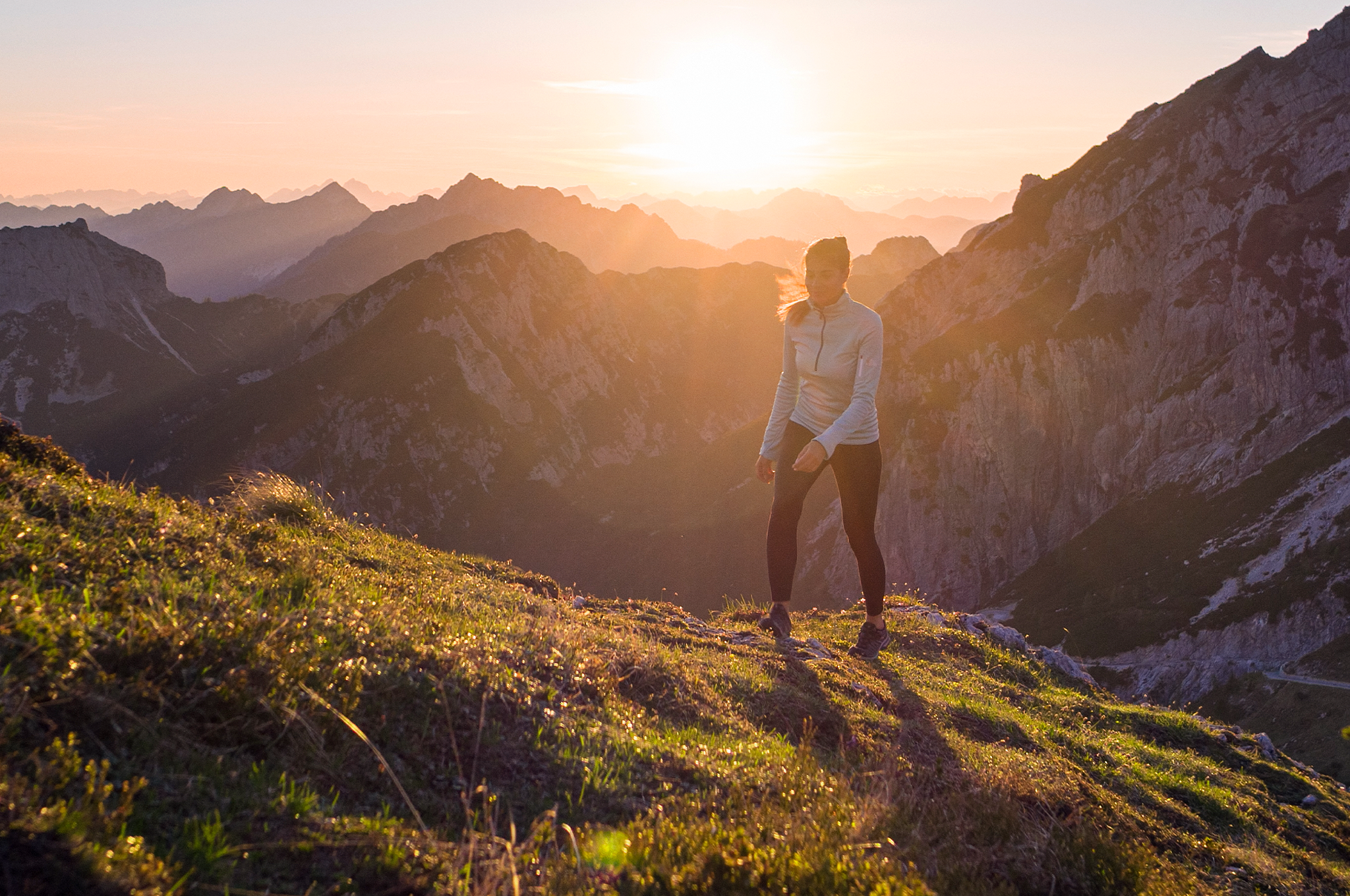 Woman hiking up a mountain