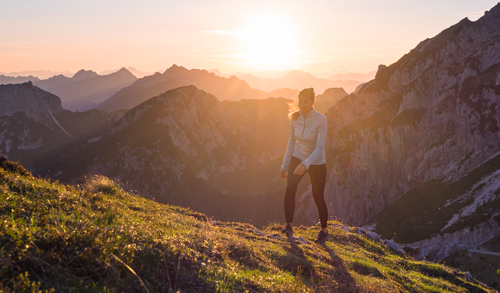 Woman hiking up a mountain