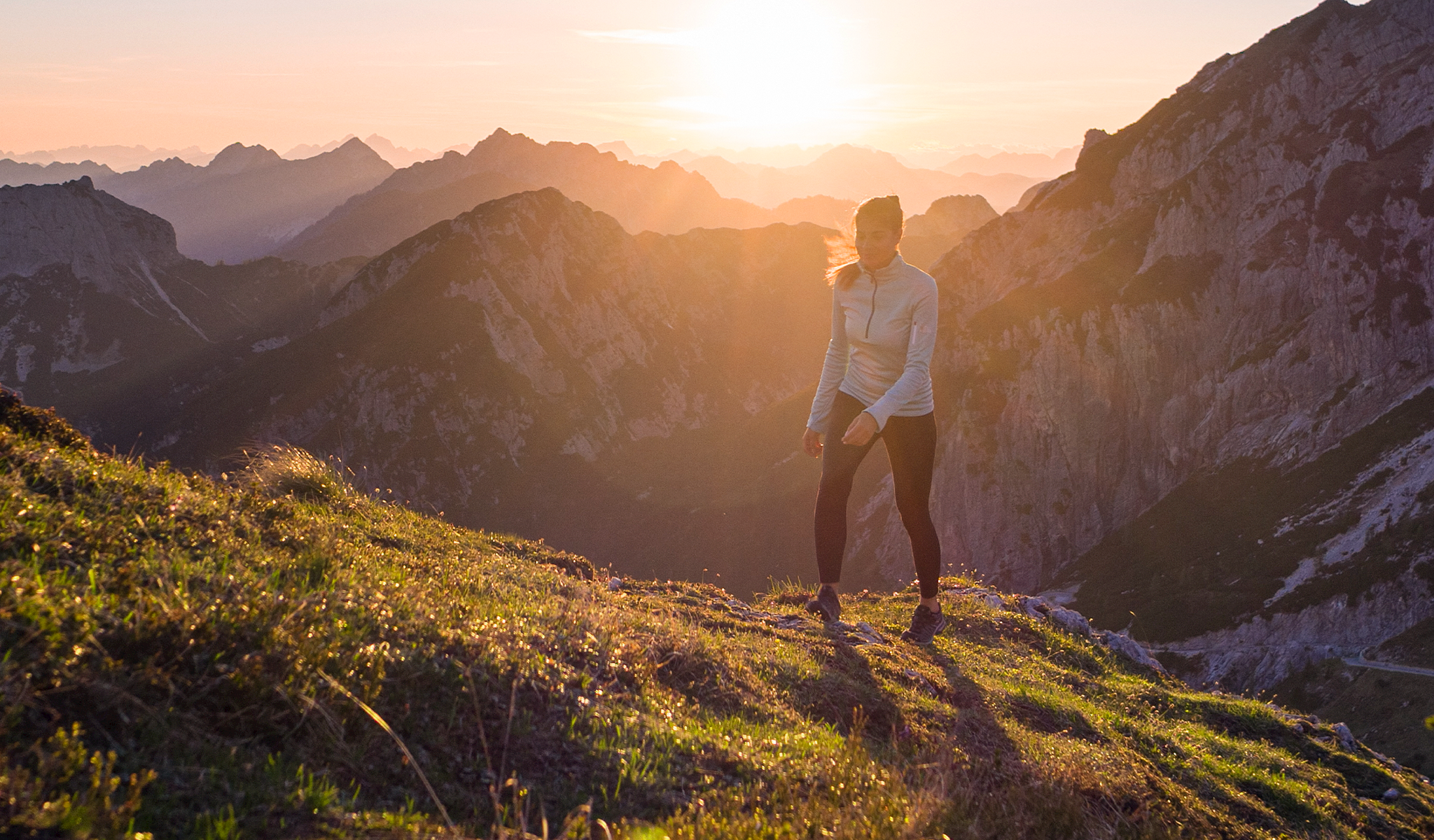 Woman hiking up a mountain