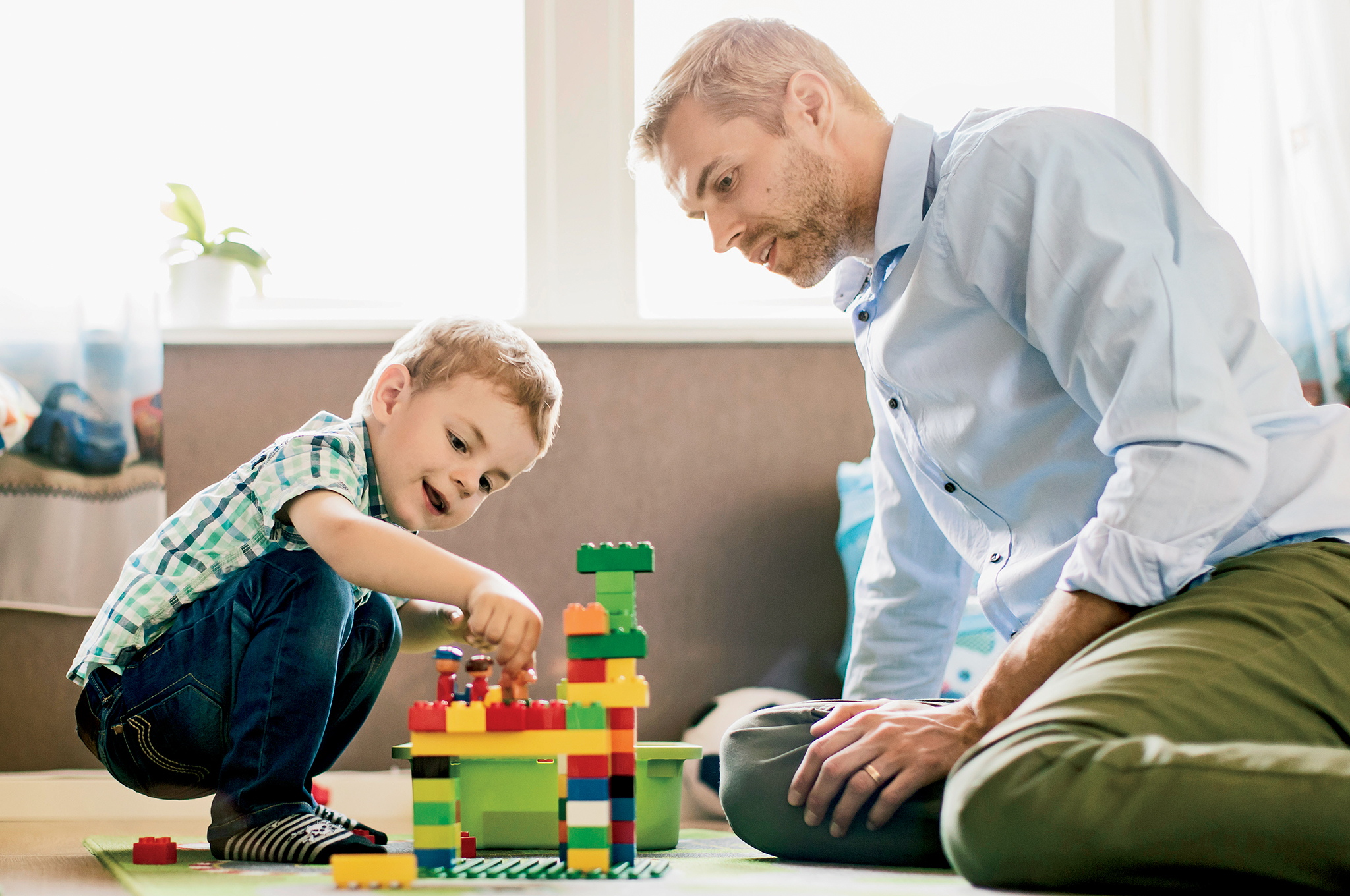 Dad and son playing on the floor