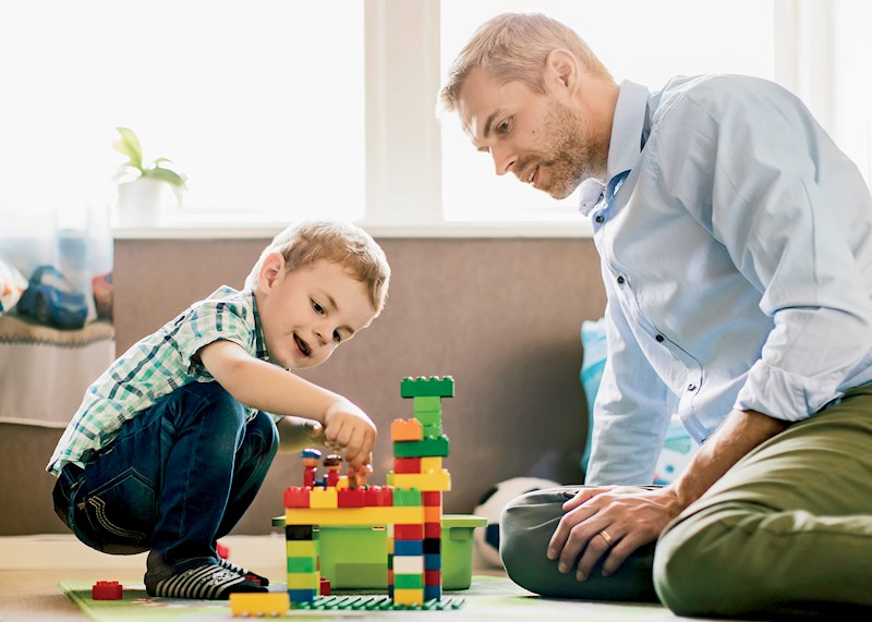 Dad and son playing on the floor