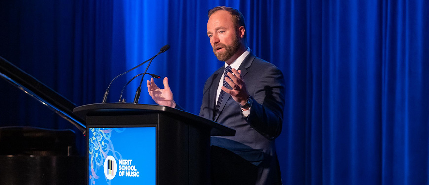 Ryan DeVore, William Blair global head of private wealth management and vice chair of the Merit board, speaks at the group’s gala